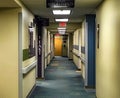 Clinic hallway with directional signs and lights