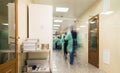 Clinic staff wearing medical uniforms in a hospital corridor Royalty Free Stock Photo