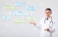 Clinical doctor pointing to health and fitness collection of words