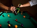 Clinking beer bottles at snooker Royalty Free Stock Photo