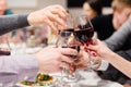 Clinking glasses of wine. Cheers after speech. Party at cafe or restaurant. Family celebration or anniversary Royalty Free Stock Photo