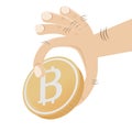 Hand grabbing bitcoin