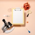Clipboard with blank copyspace surrounded with tube rack, syringe, pipet and microscope 3D illustration.