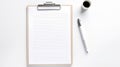 A clipboard with a blank paper, a pen and a coffee cup on a white background. The clipboard is wooden and has a silver Royalty Free Stock Photo