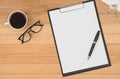 Clipboard with blank recycle paper, pen ,eyeglasses and coffee c Royalty Free Stock Photo