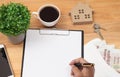 Clipboard with blank recycle paper, pen ,eyeglasses and coffee c