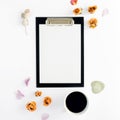 Clipboard with blank sheet of paper, coffee, eucalyptus, dry roseson Royalty Free Stock Photo