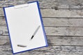 Clipboard with blank white paper with fountain pen Royalty Free Stock Photo