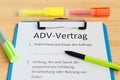 Clipboard with a contract and inscription in german ADV-Vertrag in english ADV contract and subject matter and duration of the con