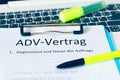 Clipboard with a contract and inscription in german ADV-Vertrag in english ADV contract and subject matter and duration of the con