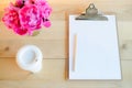 Clipboard, cup and flowers Royalty Free Stock Photo