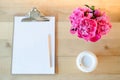 Clipboard, cup and flowers Royalty Free Stock Photo