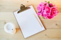 Clipboard, cup and flowers Royalty Free Stock Photo