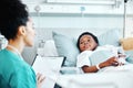 Clipboard, doctor and child in bed at hospital for recovery of surgery, illness or medical diagnosis. Healthcare Royalty Free Stock Photo