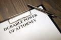 Clipboard with durable power of attorney and pen on desk Royalty Free Stock Photo