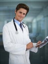 Clipboard, happy and portrait of doctor in his office for diagnosis or treatment at medical hospital. Checklist, career