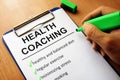 Clipboard with health coaching list. Royalty Free Stock Photo