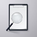 Clipboard and magnifying glass