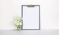 Clipboard mockup with white flowers