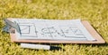 Clipboard, paper and soccer strategy, planning with tactics for team game plan and formation on a grass sport field