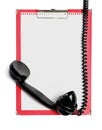 Clipboard with paper and vintage phone receiver Royalty Free Stock Photo