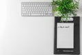 Clipboard with phrase CHECK MAIL and computer keyboard on white background