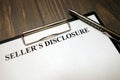 Clipboard with sellers disclosure mockup and pen on desk Royalty Free Stock Photo