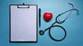 Clipboard, stethoscope and red heart on blue background. Healthcare and medical. Royalty Free Stock Photo