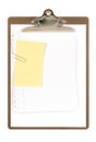 Clipboard with untidy notepaper and yellow post-it style sticky note isolated on white background, copy space Royalty Free Stock Photo