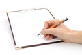 Clipboard with Writting Hand Royalty Free Stock Photo