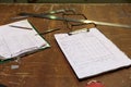 Clipboards with order notes on workshop table Royalty Free Stock Photo