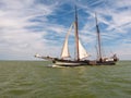 Clipper and brown fleet charter ship sailing on IJsselmeer lake, Netherlands