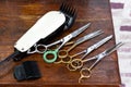 Clippers and many scissors placed on the wooden table Royalty Free Stock Photo