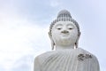 Clipping path, big white marble Buddha  on cloudy sky background, copy space, Phuket, Thailand Royalty Free Stock Photo