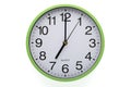 Clipping path included. Clock on white background showing seven o`clock