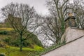 Clitheroe castle on a winters day, on a hill with house roof and chimney. Royalty Free Stock Photo