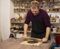 Skilled master preparing clay pieces for his new creations