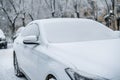 Cloaeup photo of car covered in snow in winter season d