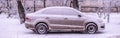 Cloaeup photo of car covered in snow in winter season d