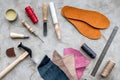 Clobber preparing his tools for work. Grey stone desk background top view