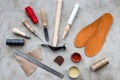 Clobber preparing his tools for work. Grey stone desk background top view