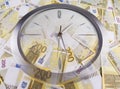 A clock and 200 euro banknotes Royalty Free Stock Photo