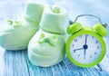 Clock and baby socks Royalty Free Stock Photo