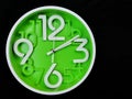 Clock on black background. The time is 2:10 am or pm. Two o& x27;clock pass ten minutes am or pm. Royalty Free Stock Photo