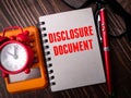 Clock,calculator,pen and notebook with text DISCLOSURE DOCUMENT Royalty Free Stock Photo