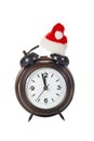 Clock with christmas hat Royalty Free Stock Photo