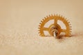 Clock detail - a gear in the sand Royalty Free Stock Photo