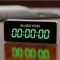 Clock displaying BILLABLE HOURS with a time of 00 00 00 in bright green Royalty Free Stock Photo