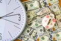 Clock, dollars and piggy bank. Concept time is money. View from above. Business, finance. Royalty Free Stock Photo