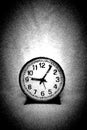 A very simple round black and white clock against empty background Royalty Free Stock Photo